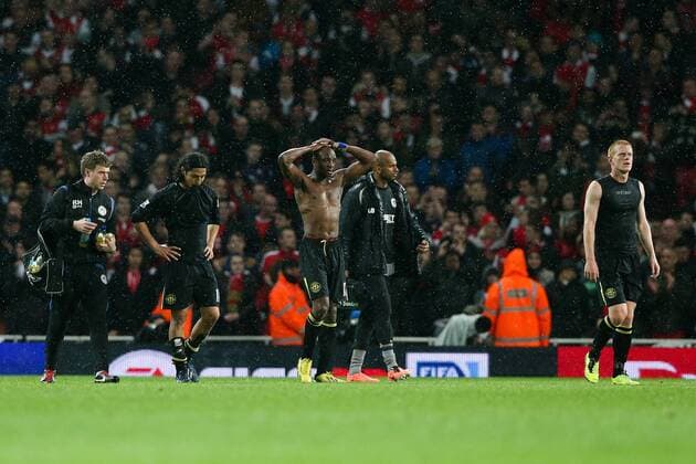 Football - 2012 2013 Premier League - Arsenal vs Wigan Wigan s Ben Watson, Wigan s Emmerson Boyce and Wigan s Roger Espinoza look dejected after losing at the Emirates Stadium, London 