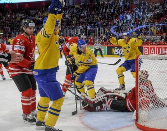 Stockholm 2013 05 16 Ice-Hockey World Championship 2013 - Canada CAN vs Sweden SWE - Pictures shows Swe takes the lead with a power-play goal to 2-1 - Luke Schenn CAN 22, Henrik Sedin SWE 33, Loui Eriksson SWE 21 Staffan Kronwall SWE 4 and gk Mike Smith CAN - KPkod 08002 