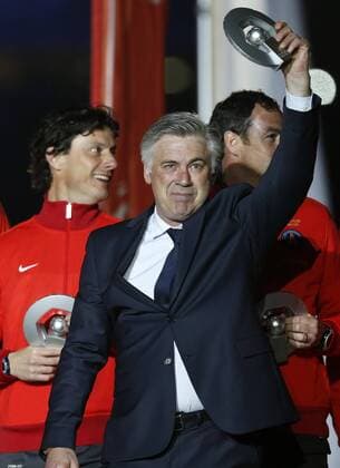 (130519) -- PARIS, 2013 (Xinhua) -- Paris Saint-Germain s manager Carlo Ancelotti reacts during the celebration for winning the French League 1 title after the League 1 football match between Paris St Germain and Brest at Parc des Princes stadium in Paris on May 18, 2013. (Xinhua Wang Lili) (SP)FRANCE-PARIS-SOCCER-SAINT-GERMIAN-CHAMPION 