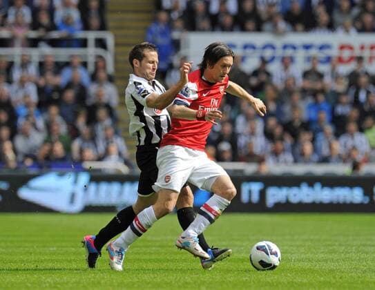Yohan Cabaye of Newcastle United (L) challenges Tomas Rosicky of Arsenal - Barclays Premier League - Newcastle United - Arsenal FC London. St. James Park - Newcastle - 19 05 2013 - PicxRichardxLee Sportimage EDITORIAL USE ONLY. No use with unauthorised audio, video, data, fixture lists, club league logos or live services. Online in-match use limited to 120 images, no video emulation. No use in betting, games or single club league player publications.