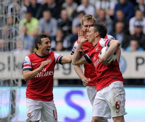 Laurent Koscielny (L) of Arsenal celebrates scoring their first goal - Barclays Premier League - Newcastle United - Arsenal FC London. St. James Park - Newcastle - 19 05 2013 - PicxRichardxLee Sportimage EDITORIAL USE ONLY. No use with unauthorised audio, video, data, fixture lists, club league logos or live services. Online in-match use limited to 120 images, no video emulation. No use in betting, games or single club league player publications.