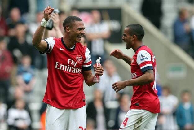 Football - English Premiership - Newcastle v Arsenal Arsesnal players Keiren Gibbs and Theo Walcott celebrate securing Champions League football during the Newcastle v Arsenal, Barclay s Premier League football match at St James Park, Newcastle. Colorsport 19th May 2013 