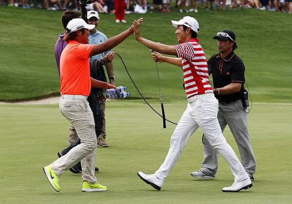 May 19, 2013: Sang-Moon Bae (L) celebrates on the green with D.H. Lee a fellow PGA Golf Herren golfer from South Korea after winning the HP Byron Nelson during the final round of the HP Byron Nelson Championship played at TPC Las Colinas Four Season Resort in Irving, TX. GOLF: MAY 19 PGA Golf Herren - HP Byron Nelson Championship - Final Round Icon1305190973 EDITORIAL USE ONLY