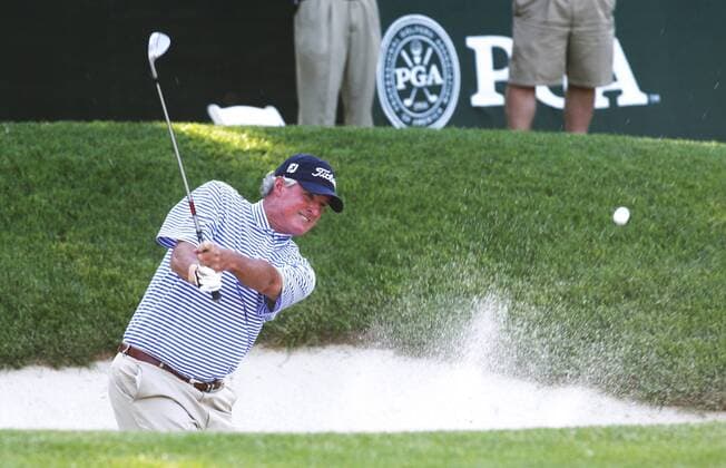 Russ Cochran of Paducah, KY hits from the trap on the ninth hole of the second round of the 74th Senior PGA Golf Herren Championship in St. Louis on May 23, 2013. Cochran ended his day tied for the lead at seven under par.  SLP2013052401