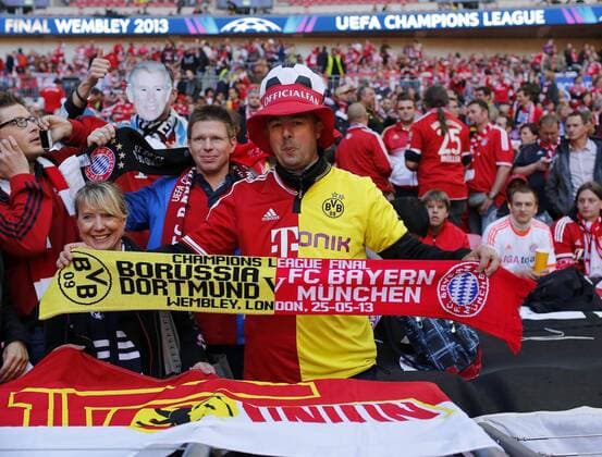 A Munich fan with a shirt and scarf for both sides - Borussia Dortmund vs Bayern Munich - UEFA Champions League Final - Wembley Stadium - London - England -25 05 2013 - Pic David Klein Sportimage EDITORIAL USE ONLY. No use with unauthorised audio, video, data, fixture lists, club league logos or live services. Online in-match use limited to 120 images, no video emulation. No use in betting, games or single club league player publications.