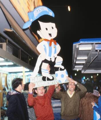 Football - 1978 World Cup - Argentina fans celebrate in the street with a cut-out of the competition mascot after victory at Estadio Monumental, Buenos Aires. 25 06 1978 
