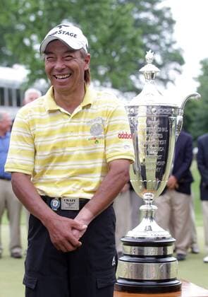 Kohki Idoki of Japan stands near the Bourne Trophy after winning the 74th Senior PGA Golf Herren Championship at Bellerive Country Club in St. Louis on May 26, 2013. Idoki won the tournament with an 11 under.  SLP2013052624