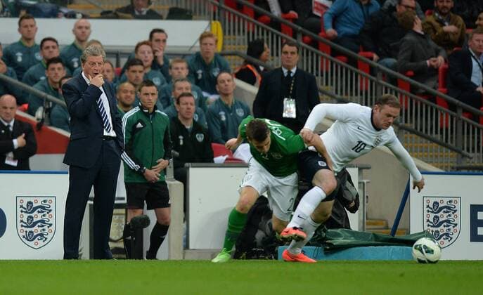 Roy Hodgson coach of England looks on as Wayne Rooney of England tussles with Seamus Coleman of Ireland - International Friendly - England vs Republic of Ireland - Wembley Stadium - London - England - 29 05 13 - Picture Simon Bellis Sportimage EDITORIAL USE ONLY. No use with unauthorised audio, video, data, fixture lists, club league logos or live services. Online in-match use limited to 120 images, no video emulation. No use in betting, games or single club league player publications.