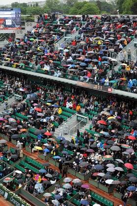 30.05.2013 Paris, France. The fans put up their umbrellas to shelter from the rain during the match between Novak Djokovic of Serbia and Guido Pella of Argentina in the second round of the French Open from Roland Garros. xDavidxEmmx  ActionPlus20253399
