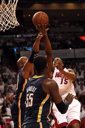 May 30, 2013 - Miami, FL, USA - The Miami Heat s Mario Chalmers (15) goes to the basket against the Indiana Pacers Roy Hibbert (55) and David West in the first quarter in Game 5 of the Eastern Conference finals on,Thursday, May 30, 2013, at AmericanAirlines Arena in Miami, Florida. Game 5: Indiana at Miami - ZUMAm67