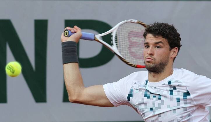 Grigor Dimitrov of Bulgaria returns a shot during the men s singles third round match at the 2013 French Open tennis tournament in Paris, France, on June 1, 2013. (SP)FRANCE-PARIS-TENNIS-FRENCH OPEN 
