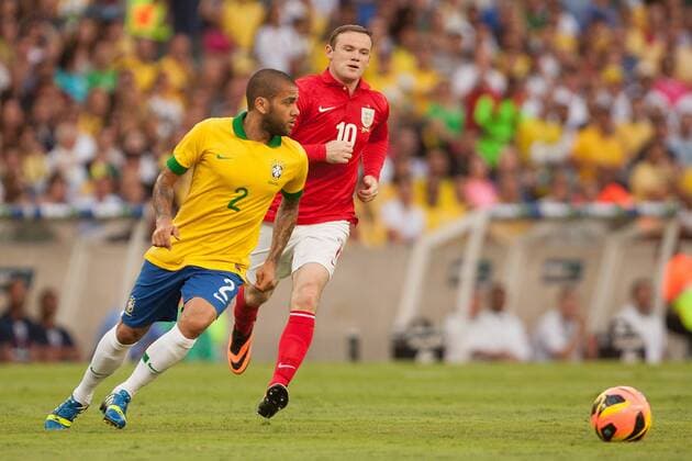 Football - International Friendly - Brazil vs. England Wayne Rooney of England chases Daniel Alves da Silva of Brazil at the Maracana Stadium, Rio de Janeiro 