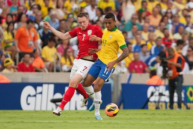 Football - International Friendly - Brazil vs. England Phil Jones of England battles Luiz Gustavo of Brazil at the Maracana Stadium, Rio de Janeiro 