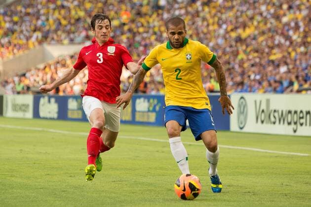 Football - International Friendly - Brazil vs. England Leighton Baines of England closes down Daniel Alves da Silva of Brazil at the Maracana Stadium, Rio de Janeiro 