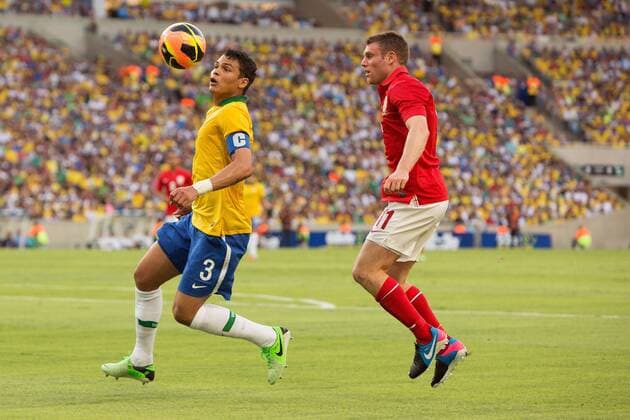 Football - International Friendly - Brazil vs. England Thiago Silva of Brazil and James Milner of England in action at the Maracana Stadium, Rio de Janeiro 