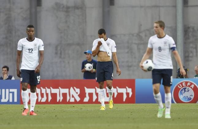 England s Steven Caulker looks on dejected after going 2-0 down - England U21 vs Norway U21 - UEFA U21 Championship 2013 - Ha Moshava Stadium - Petah Tikva - Israel - 08 06 2013 - Pic David Klein Sportimage EDITORIAL USE ONLY. No use with unauthorised audio, video, data, fixture lists, club league logos or live services. Online in-match use limited to 120 images, no video emulation. No use in betting, games or single club league player publications.