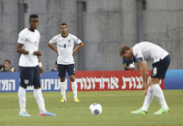 England s Steven Caulker looks on dejected after going 2-0 down - England U21 vs Norway U21 - UEFA U21 Championship 2013 - Ha Moshava Stadium - Petah Tikva - Israel - 08 06 2013 - Pic David Klein Sportimage EDITORIAL USE ONLY. No use with unauthorised audio, video, data, fixture lists, club league logos or live services. Online in-match use limited to 120 images, no video emulation. No use in betting, games or single club league player publications.