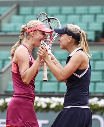 (130609) -- PARIS, June 9, 2013 (Xinhua) -- Ekaterina Makarova and Elena Vesnina (R) of Russia celebrate after winning the women s doubles final match against Sara Errani and Roberta Vinci of Italy at the French Open tennis tournament in Paris June 9, 2013. Ekaterina Makarova and Elena Vesnina won 2-0 to claim the title. (Xinhua Tang Shi) (SP) FRANCE-PARIS-TENNIS-WOMEN S DOUBLES FINAL 