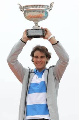 PARIS, June 10, 2013 -- Spain s Rafael Nadal poses with the trophy at the Disneyland in Paris June 10, 2013. 