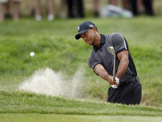 June 11, 2013 - Ardmore, PA, USA - Tiger Woods hits the golf ball out of the fifth hole bunker during practice for the U.S. Open golf championship at Merion Golf Club in Ardmore, Pennsylvania, Tuesday, June 11, 2013. U.S. Open - ZUMAm67