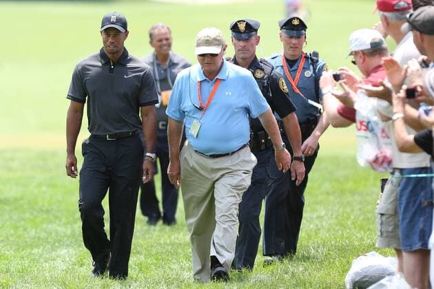June 11 2013: Fans cheer as Tiger Woods makes his way to start his practice round on the 1st tee while being escorted by a PGA Golf Herren Official and two Haverford Township Police Officers during tuesday s practice round at the 2013 U.S. Open hosted by Merion Golf Club in Ardmore, PA. GOLF: JUN 11 PGA Golf Herren - U.S. Open - Tuesday Practice Round Icon20325861 EDITORIAL USE ONLY
