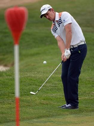Justin Rose putts chips onto the 14th green during the first round of the 113th U.S. Open Championship at Merion Golf Club in Ardmore, Pennsylvania on June 12, 2013.  PHI20130613320