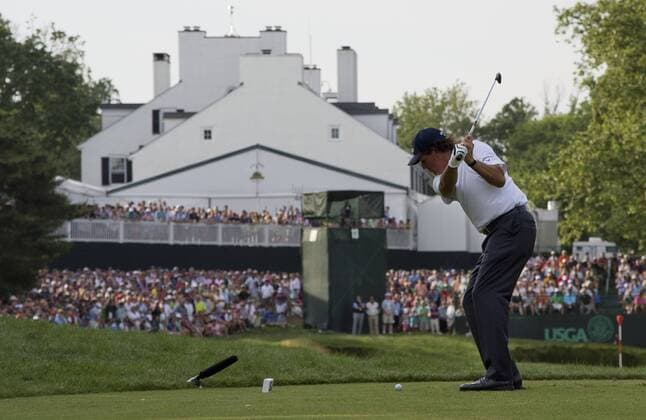 Phil Mickelson hits off of the 13th tee, during the third round 113th U.S. Open Championship at Merion Golf Club in Ardmore, Pennsylvania on June 15, 2013.  PHI20130615322