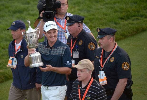 Justin Rose carries the USA Open Championship Trophy after winning the 113th U.S. Open Championship at Merion Golf Club in Ardmore, Pennsylvania on June 16, 2013. Rose won the USA Open with a four day total of one-over-par with a 281.  PHI20130616324
