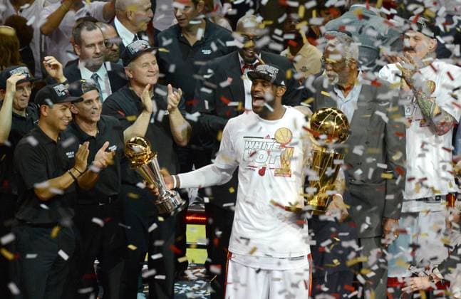(130621) -- MIAMI, June 20, 2013 (Xinhua) -- LeBron James (3rd R, front) of Miami Heat holds the Larry O Brien trophy and the MVP trophy during the awarding ceremony of the NBA Basketball Herren USA finals after defeating San Antonio Spurs in Miami, the United States on June 20, 2013. Miami Heat won 95-88 and claimed the champion by 4-3. (Xinhua Wang Lei) (lm) (SP)US-MIAMI-NBA-FINALS-GAME 7 