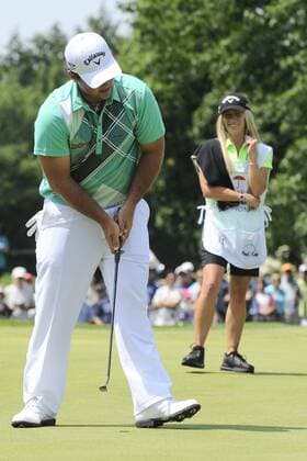 June 22, 2013 - Cromwell, Connecticut, USA - Jun 22, 2013 - Cromwell, Connecticut, U.S. - Patrick Reed putts a birdie on the 2nd green as wife and caddy Justine smiles during the third round of the PGA Golf Herren Travelers Championship held at TPC River Highland in Cromwell Connecticut Eric Canha CSM PGA Golf Herren 2013: Travelers Championship JUN 22 - ZUMAc04
