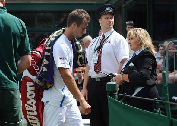 Tennis - 2013 Wimbledon Championships - Mens Singles First Round Philipp Kohlschreiber on Court 18. Philipp Kohlschreiber - Germany leaves the court after retiring in the 5th set 