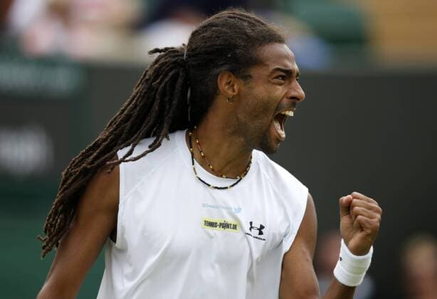 (130626) -- LONDON, June 26, 2013 (Xinhua) -- Dustin Brown of Germany celebrates during the second round of gentlemen s singles day 3 of the Wimbledon Lawn Tennis Championships at the All England Lawn Tennis Club in London, Britain on June 26, 2013. 