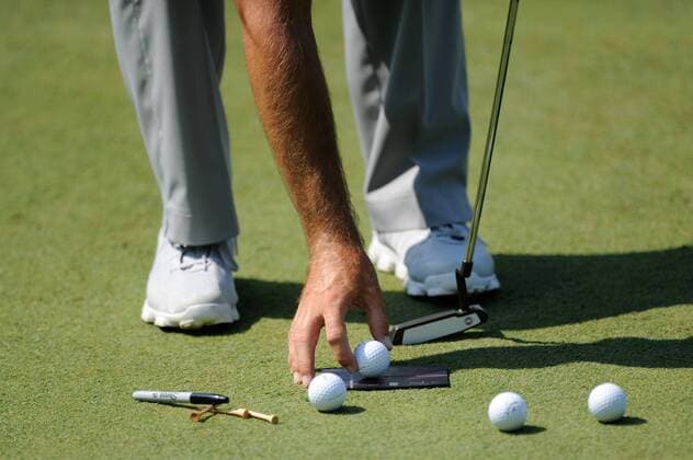 June 26, 2013 - A golfer works on his putting skills with his caddie during Pro-Am play at Congressional Country Club in Bethesda MD. Golf 2013: ATandT National Pro-Am JUN 26 - ZUMAcjm