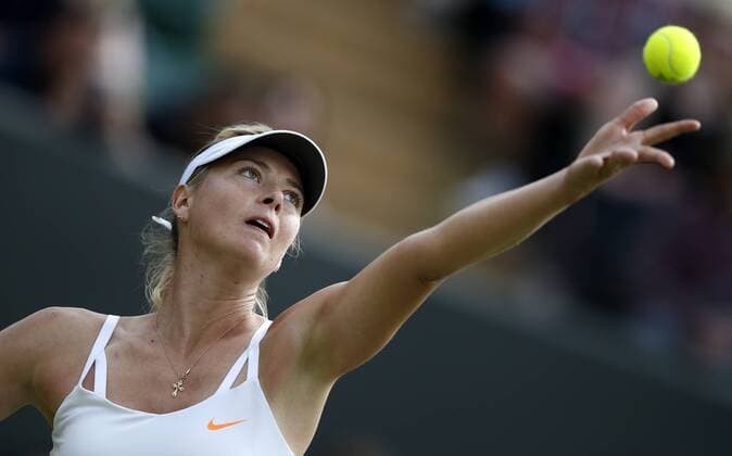 Maria Sharapova of Russia competes during the second round of women s singles on day 3 of the Wimbledon Lawn Tennis Championships at the All England Lawn Tennis and Croquet Club in London, Britain, on June 26, 2013. (Xinhua Wang Lili) (SP)BRITAIN-LONDON-TENNIS-WIMBLEDON-DAY 3-SHARAPOVA 