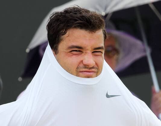 Grigor Dimitrov changes his shirt during his match at the Wimbledon Tennis Championships, Thursday, 27th June 2013 Picture by StephenxLock i-Images StephenxLockx xi-Images  IIM-0153-0028