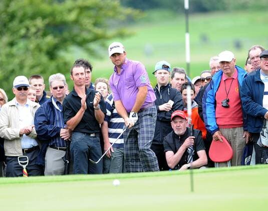 27.06.2013 Maynooth, Ireland. Graeme McDowell watches his ball after chipping onto the 5th green during the second round of the Irish Open from Carton House Golf Club xTommyxGrealyx  ActionPlus00000127777