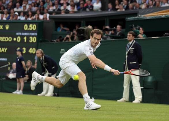 Great Britain s Andy Murray runs for a ball in his match on day five of the 2013 Wimbledon Championships in London on June 28, 2013.  LON2013062827