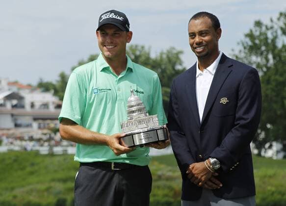 Bill Haas poses with Tiger Woods after winning the AT&T National at Congressional Country Club on June 30, 2013 in Bethesda, Maryland.  WAP20130630830