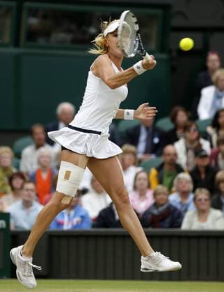 LONDON, July 2, 2013 -- Agnieszka Radwanska of Poland returns the ball during the quarterfinal of women s singles on day 8 of the Wimbledon Lawn Tennis Championships at the All England Lawn Tennis and Croquet Club in London, Britain on July 2, 2013. 