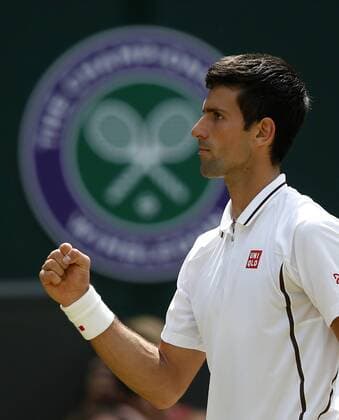 (130705) -- LONDON, July 5, 2013 (Xinhua) -- Novak Djokovic of Serbia celebrates for a point during the semifinal of gentlemen s singles on day 11 of the Wimbledon Lawn Tennis Championships at the All England Lawn Tennis and Croquet Club in London, Britain on July 5, 2013. (Xinhua Wang Lili) (SP)BRITAIN-LONDON-TENNIS-WIMBLEDON-DAY 11 