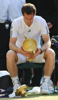 The lid of the trophy drops to the ground after Andy Murray wins the Men s Final at the Wimbledon Tennis Championships in London, Sunday, 7th July 2013  IIM-0194-0053