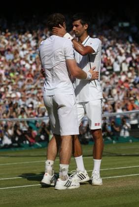 Andy Murray hugs Novak Djokovic after defeating him to win the 2013 Wimbledon Championships in the final round, in London on July 7 , 2013. Murray won 6-4, 7-5, 6-4.  LON2013070718