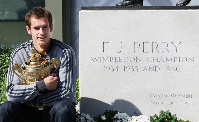 Andy Murray of Great Britain poses with the Gentlemen s Singles Trophy next to the Fred Perry statue at Wimbledon London, United Kingdom, Monday July 08, 2013. Photo by: Roger Allen i-Images RogerxAllenx xi-Images  SLK