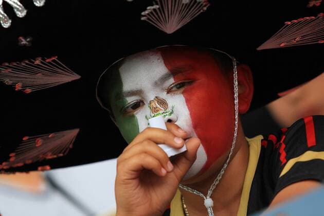 A boy reacts during the Gold Cup 2013 soccer match, Mexico in Denver, Colorado, , on July 14, 2013. (Xinhua Alfredo Lopez Jam Media) (rt) (SP) 