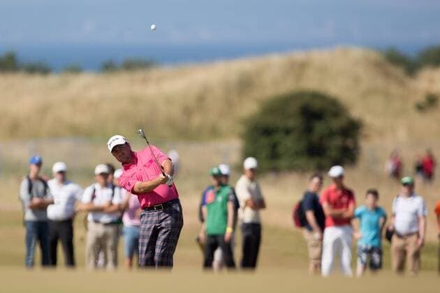Golf - 2013 Open Championship at Muirfield - Friday Round Two Graeme McDowell of Northern Ireland in action on the 5th 