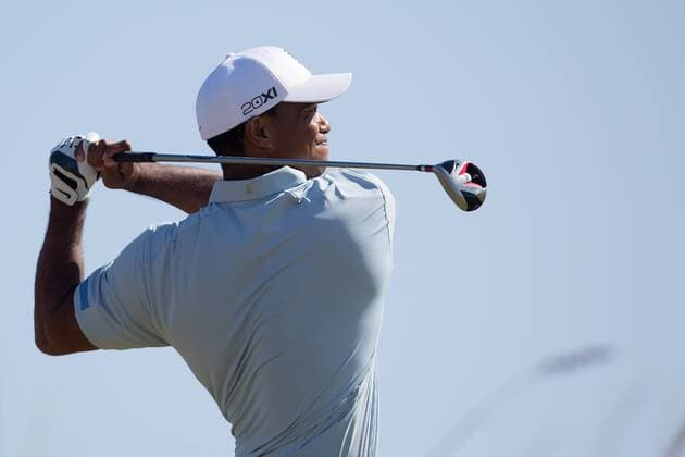 Golf - 2013 Open Championship at Muirfield - Friday Round Two Tiger Woods of USA tees off on the 6th 