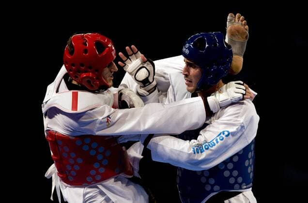 Radik Isaev (L) of Azerbaijan combats against Konstantinos Gkoltsios (R) of Greece in the 87kg male quarterfinals of the Taekwondo World Championship of the World Taekwondo Federation (WTF), at the Expositions and Coventions Center of Puebla, in Puebla, Mexico, on July 19, 2013. (Xinhua Guillermo Arias) (rt) (SP)MEXICO-PUEBLA-TAEKWONDO-WORLD CHAMPIONSHIP 