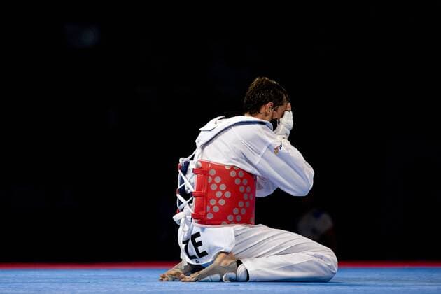 Radik Isaev of Azerbaijan, reacts , in the 87kg male quarterfinals of the Taekwondo World Championship of the World Taekwondo Federation (WTF), at the Expositions and Coventions Center of Puebla, in Puebla, Mexico, on July 19, 2013. (Xinhua Guillermo Arias) (rt) (SP)MEXICO-PUEBLA-TAEKWONDO-WORLD CHAMPIONSHIP 