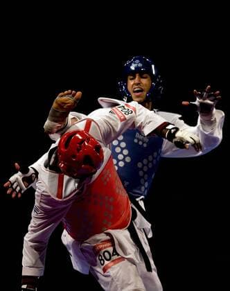 Sajjad Mardani (R) of Iran combats against Robelis Despaigne (L) of Cuba in the 87kg male semifinals of the Taekwondo World Championship of the World Taekwondo Federation (WTF), at the Expositions and Coventions Center of Puebla, in Puebla, Mexico, on July 19, 2013. (Xinhua Guillermo Arias) (py) (SP)MEXICO-PUEBLA-TAEKWONDO-WORLD CHAMPIONSHIP 