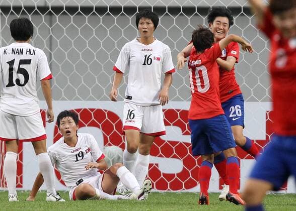 (130721) SEOUL, July 21, 2013. (Xinhua) -- Kim Soo-yun (R) of South Korea national football team celebrate after scoring a goal against Democratic People s Republic of Korea (DPRK) national football team during the EAFF Women s Asian Cup 2013 match at the Seoul World Cup Stadium in Seoul, South Korea, July 21, 2013. DPRK won the match 2-1. (Xinhua Park Jin hee) (SP)SOUTH KOREA-SEOUL-SOCCER-EAFF WOMEN S EAST ASIAN CUP 2013-DPRK VS SOUTH KOREA 